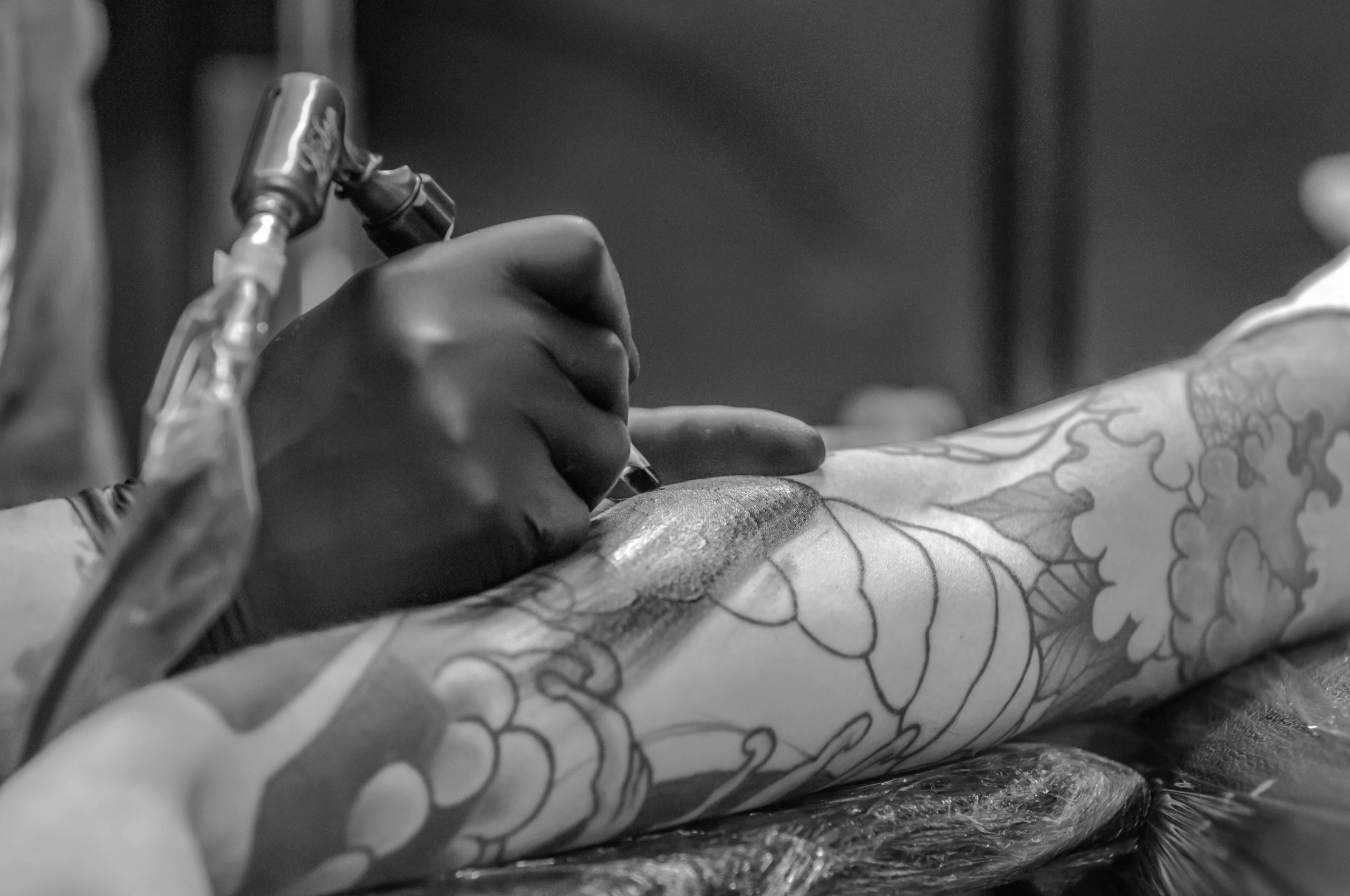 black and white getting a tattoo